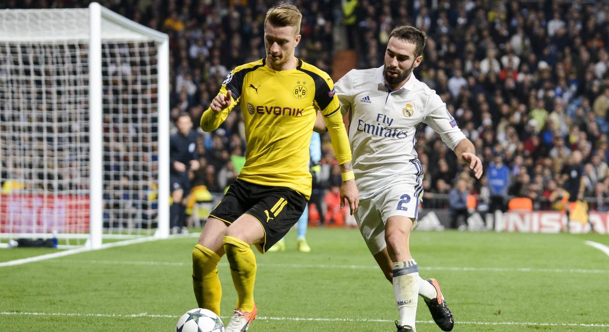 Real Madrid s Daniel Carvajal and Borussia Dortmund Marco Reus during the UEFA Champions League matc